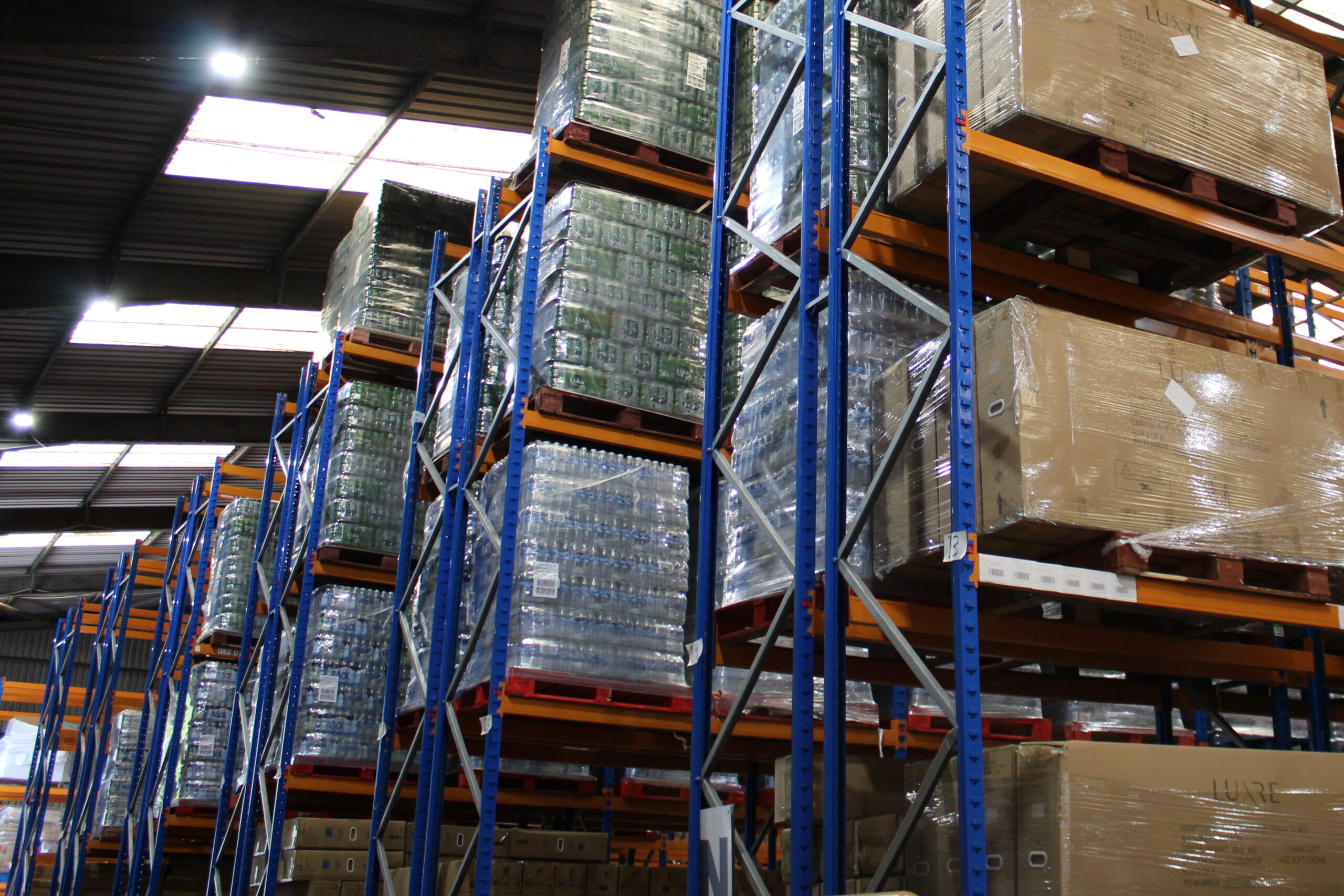 High-bay pallet racking loaded with stretch-wrapped inventory in Ayla Group's UK fulfilment warehouse